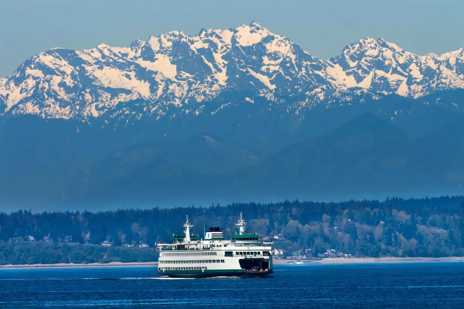 Washington State Ferries crossing Puget Sound with mountain view